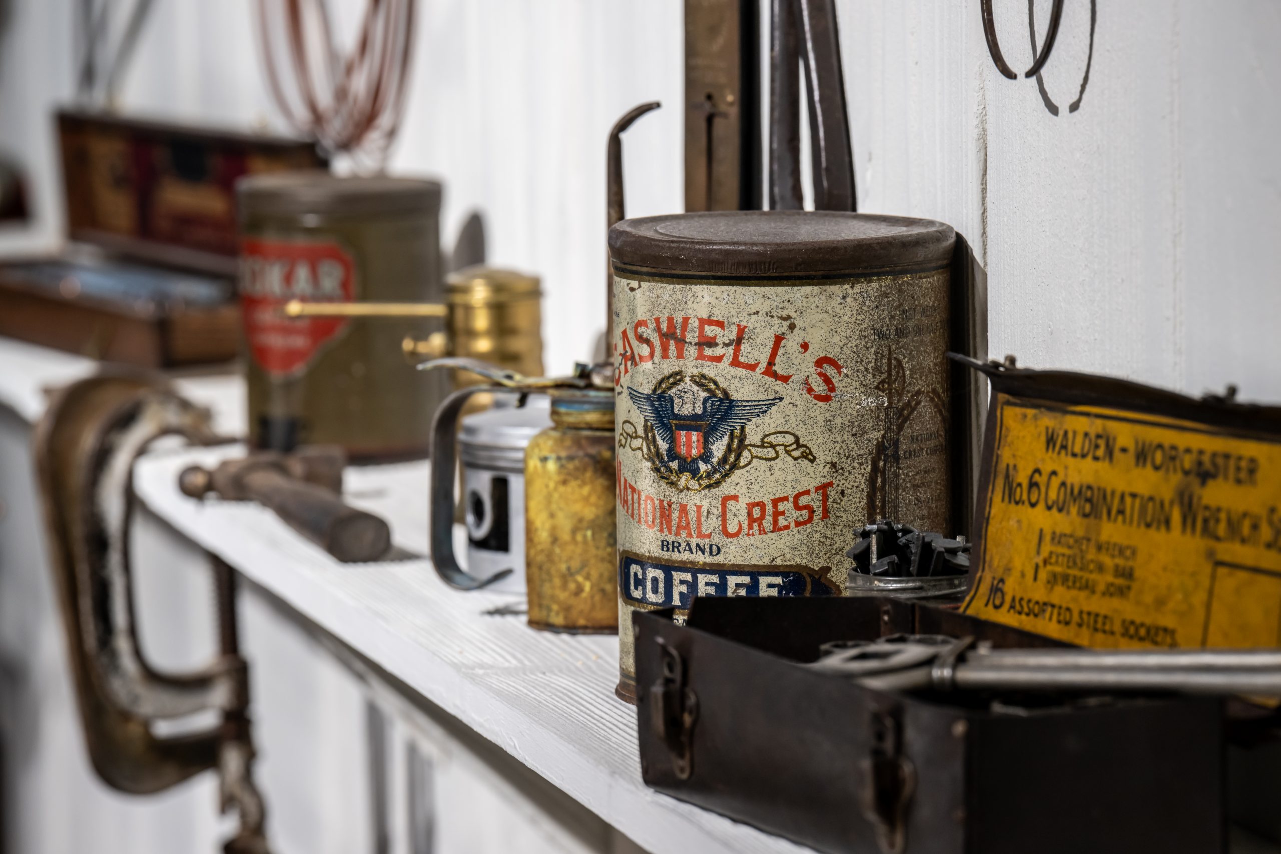 Car Workshop replica, picture of various elements typically found there, Rusty metallic coffee container & tools